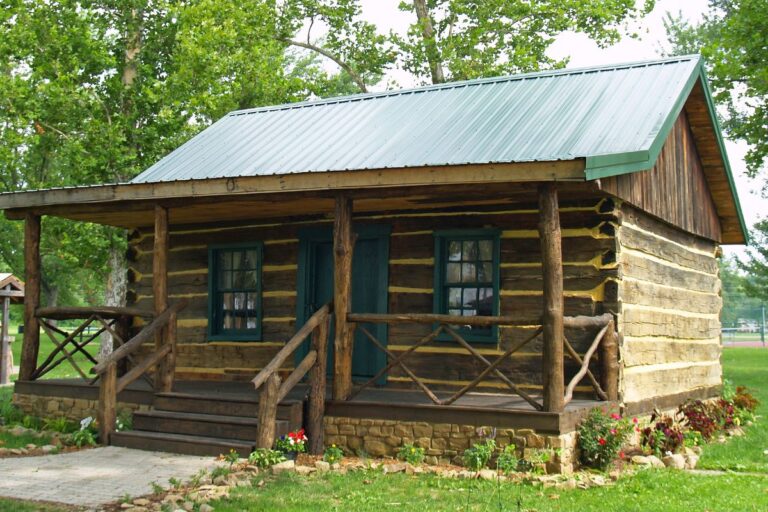 Log home restoration cost is set by four jobs, blasting, staining, chinking and rot repair, on a log cabin like this one